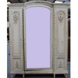 A Louis XVI style painted three door wardrobe/armoire,