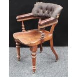 A Victorian club/tub type desk chair, curved button back, saddle seat, turned forelegs,