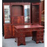 A George III inspired library suite, comprising twin pedestal desk, bookcase,