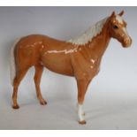 A large Beswick model of a Palomino horse, 29.