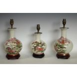 A pair oriental style baluster table lamps, decorated with fanciful birds,