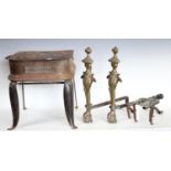 Brassware - a pair of 19th century fire dogs; a trivet; a footman;