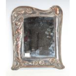 An Art Nouveau copper mirror