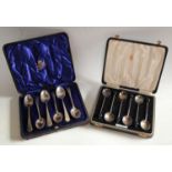 A set of six silver teaspoons, marked 925, cased; a set of six silver coffee spoons, Birmingham,