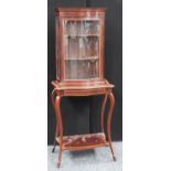 An Edwardian satinwood crossbanded mahogany serpentine display cabinet,