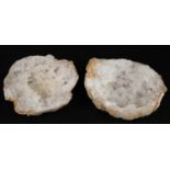 Geology - a bisected white quartz geode, cut to display matrix,