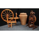 An oak spinning wheel, John Brightwell of Taunton; another, pine,