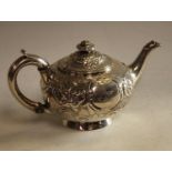A silver teapot,