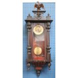 A late 19th century Art Nouveau Vienna time piece, central brass panel,