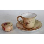 A Royal Worcester blush ivory miniature cup and saucer,