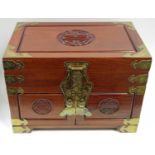 A modern Chinese metal bound mahogany jewellery casket with long life emblem to panels