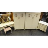 A mid 20th century French bedroom suite including two wardrobes, a dressing table,