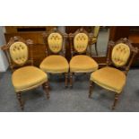 Four Victorian salon chairs, foliate carved pediment, button upholstered back, padded seat,