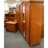 A cherry wood bedroom suite from the Pierre Fontaine collection by Younger Furniture including a