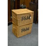 A pair of substantial Fortnum & Mason stenciled wicker baskets