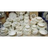 A Limoges tea service comprising tea cups, saucers, side plates, sugar bowl,
