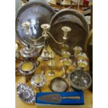 Plated ware - a three branch candelabrum; a footed serving tray; a two handled galleried tray;