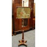 A Victorian mahogany pole screen with tapestry screen c.