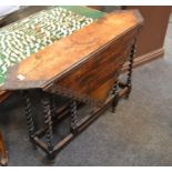 An oak Macclesfield dropleaf occasional table, foliate carved border, spiral twist supports.