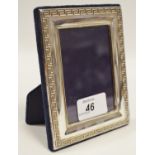 A silver easel photograph frame, Greek key border, Carrs, Sheffield, 2001. 12.
