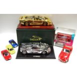 A GWILO International Limited 22ct gold plated Jaguar XJ220 1:18 scale, mounted on a plinth,
