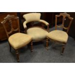 A mahogany tub chair circa 1900; two Victorian salon chairs.