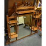 A Victorian mahogany overmantel, architectural pediment, an arrangement of five mirrors and shelves,