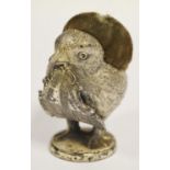 An unusual early 20th century white metal pin cushion in the form of a chick,