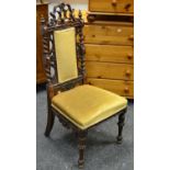 A Victorian rosewood hall chair, shaped and pierced pediment,
