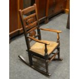 A late 18th/ early 19th century ash and elm country rocking chair c.