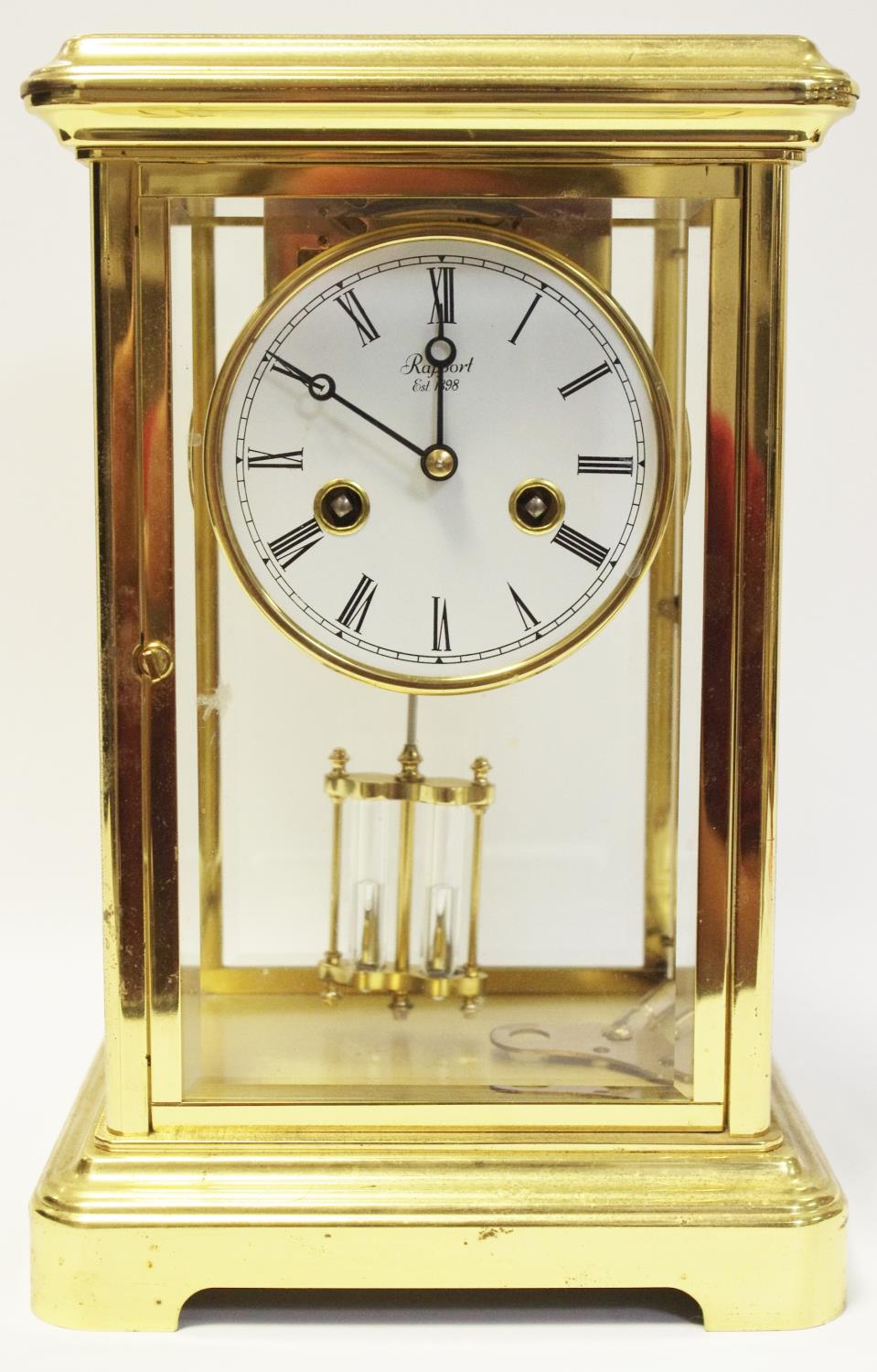 A 20th century brass mantel clock by Rapport, London, unsigned movement striking on a bell,