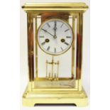 A 20th century brass mantel clock by Rapport, London, unsigned movement striking on a bell,