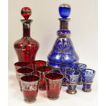 Bohemian glass flasks and glasses overlaid with silver decoration.