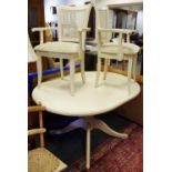 A modern white painted D-end extending pedestal table; two carvers, canework back.