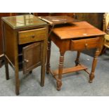 An early 20th century oak utility cabinet, short drawer over cupboard,