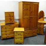 A modern pine bedroom suite comprising double wardrobe, two doors over two long drawers,