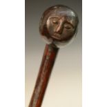 Tribal Art - a Zulu knobkerrie, the bulbous head carved with a face, 51cm long, South Africa,