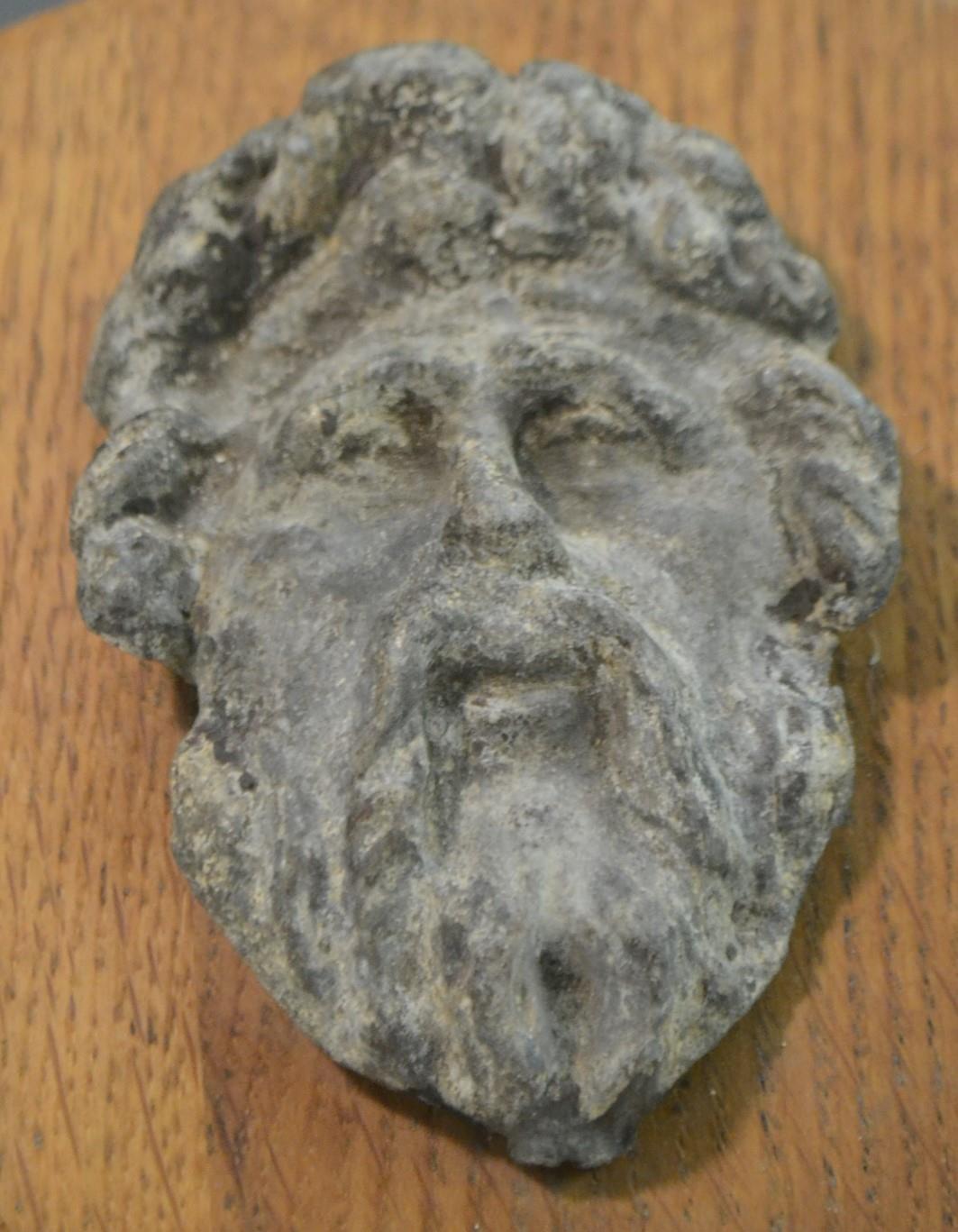 A 17th/18th century lead boss, cast as a bearded mask, mounted for the connoisseur on an oak shield, - Image 2 of 2