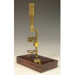 A 19th century lacquered brass travelling microscope, rack and pinion adjustment, morocco case,