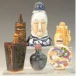 An unusual Chinese porcelain snuff bottle, modelled as a woman's head and bust,