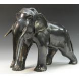 Japanese School, a brown patinated bronze, of an elephant, striding forward,