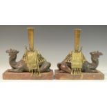 A pair of 19th century parcel gilt and brown patinated mantel bronzes,
