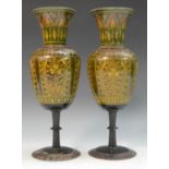 A pair of Indian softwood mantel vases, turned and decorated with stylised leaves and flowers, 27.