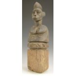 Tribal Art - a Senufo feamale bust, carved stylized scarified features, rustic circular base,