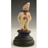 An early 20th century cold painted car mascot, cast as a pierrot, 7cm high,