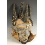 Tribal Art - a Chokwe mask, carved stylised features with bared teeth,