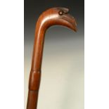 Tribal Art - a Polynesian hardwood walking stick, the handle carved as the stylised head of a bird,