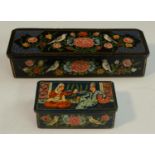 A Persian papier mache rectangular box, painted in polychrome with songbirds and summer flowers,