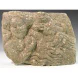 A Medieval limestone sculptural panel, carved in relief with a female figure and a stylised animal,