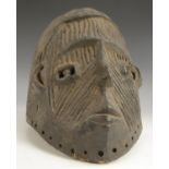 Tribal Art - a Nigerian Ekpe mask, carved as an ikan ancestor,